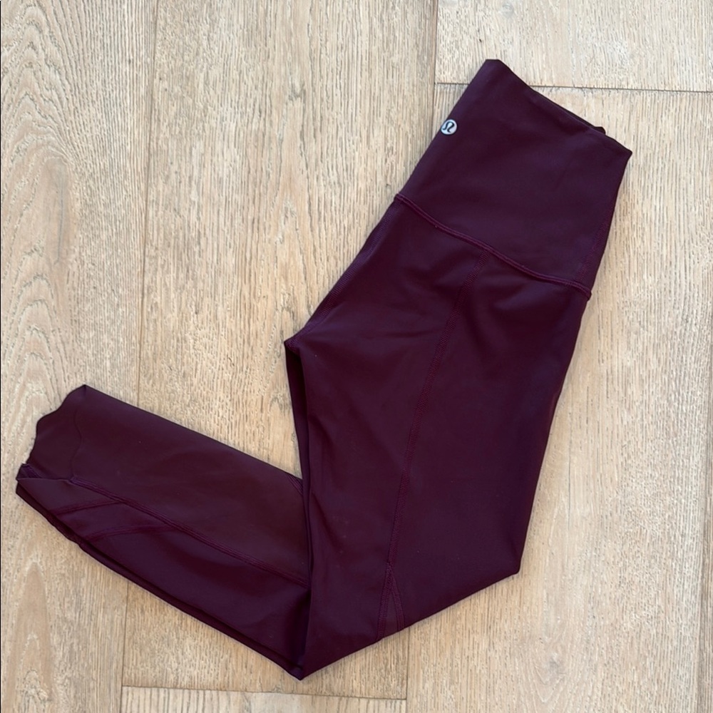 LIKE NEW: Lululemon 3/4 leggings, size 4, color is wine/burgandy